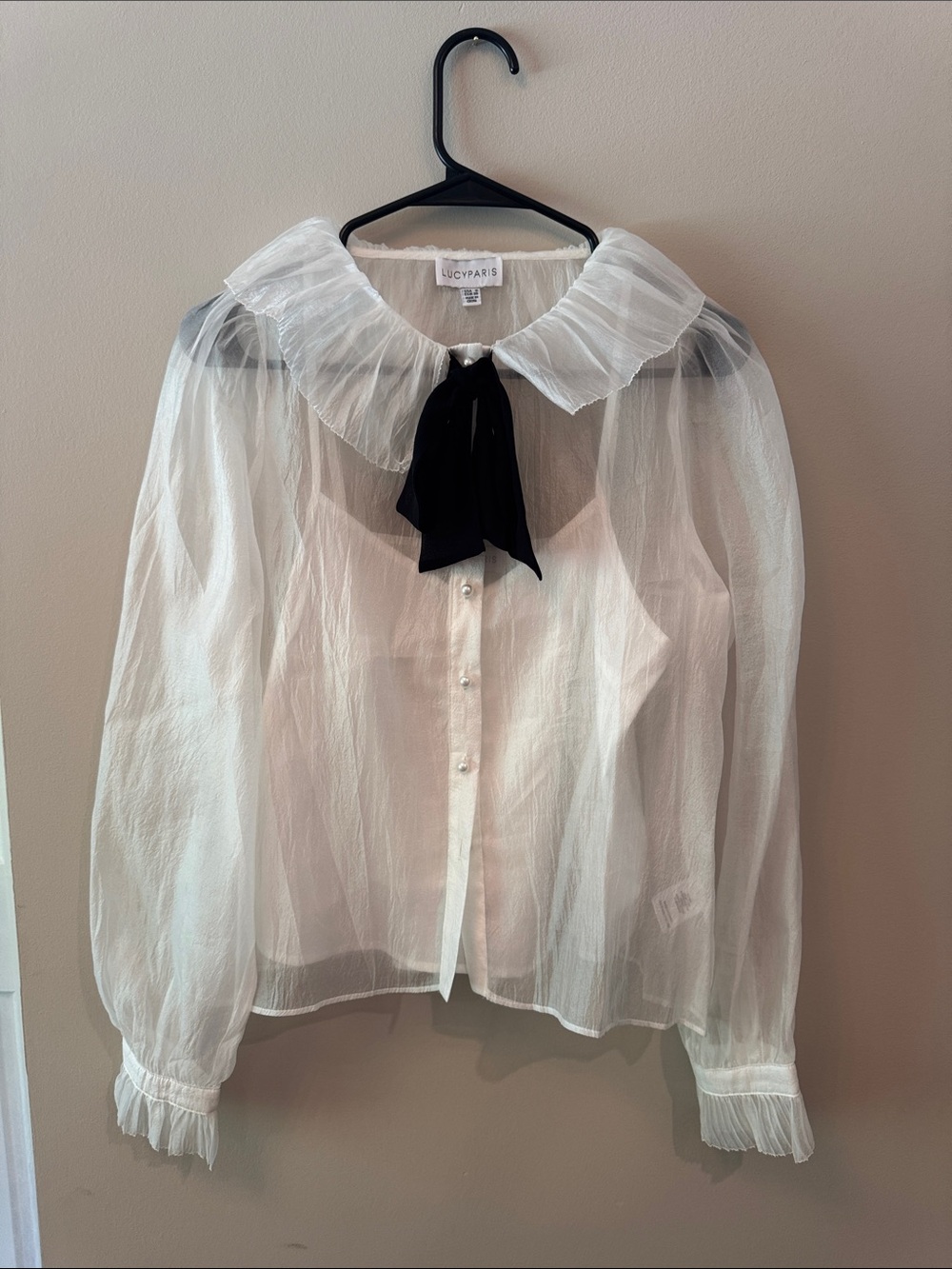 Lucy Paris White Sheer Ruffled Blouse with Black Bow